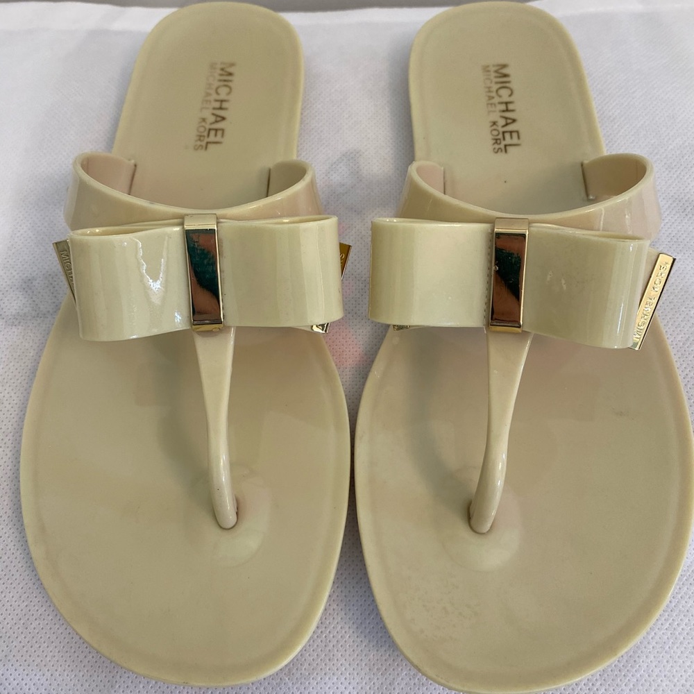 Authentic Michael by Michael Kors flip flop.